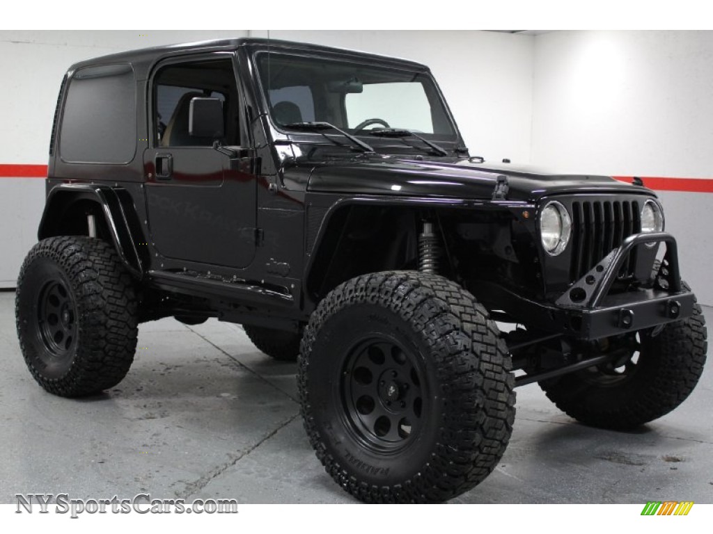 black jeep wrangler with green accents